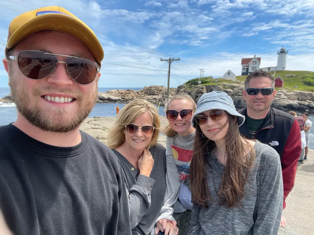 Caleb and his family on vacation at Nubble Lighthouse in Maine.