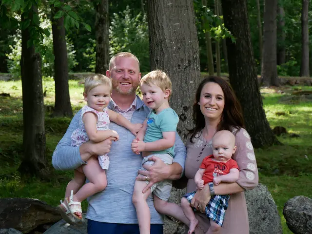 Courtney Jones with family, outdoors on The Hill